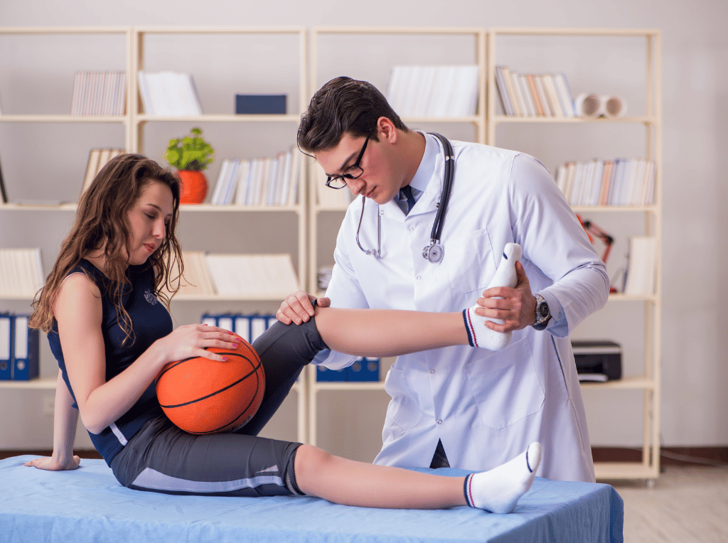 Girl Being Treated by Doctor While Holding a Basketball | Should I See a Specialist When I Get a Sports Injury VOSCT